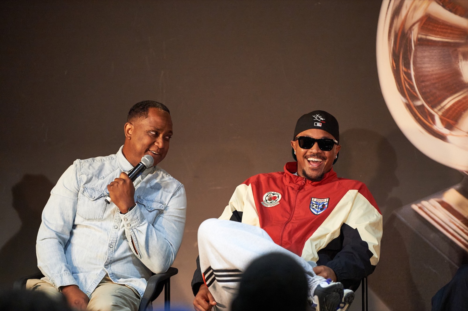 Antonio Dixon speaking on the panel as Khris Riddick-Tynes laughs
