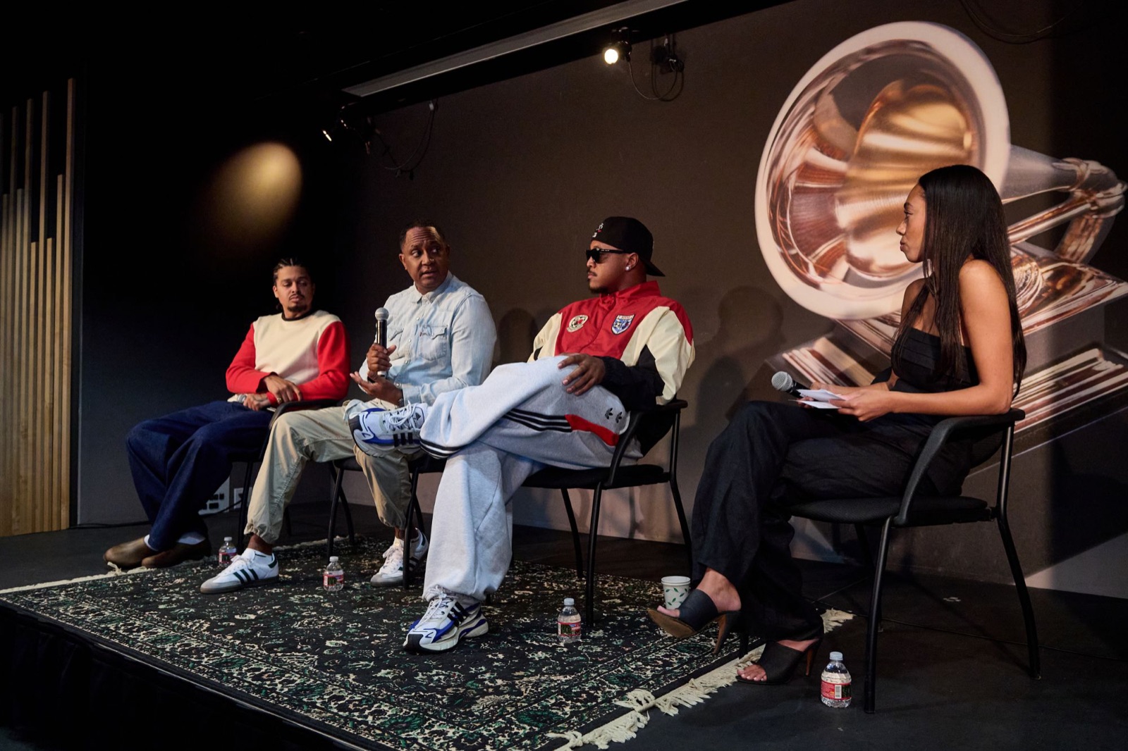 Kamal Wilson, Antonio Dixon and Khris Riddick-Tynes on stage with moderator Cheyenne Roundtree